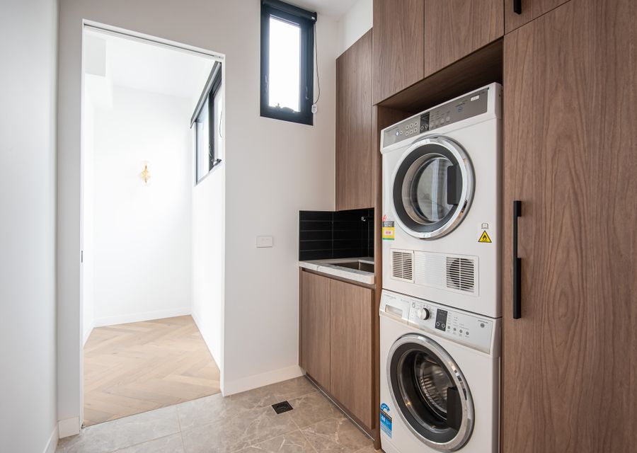 Laundry with washing machine, dryer and powder room 
