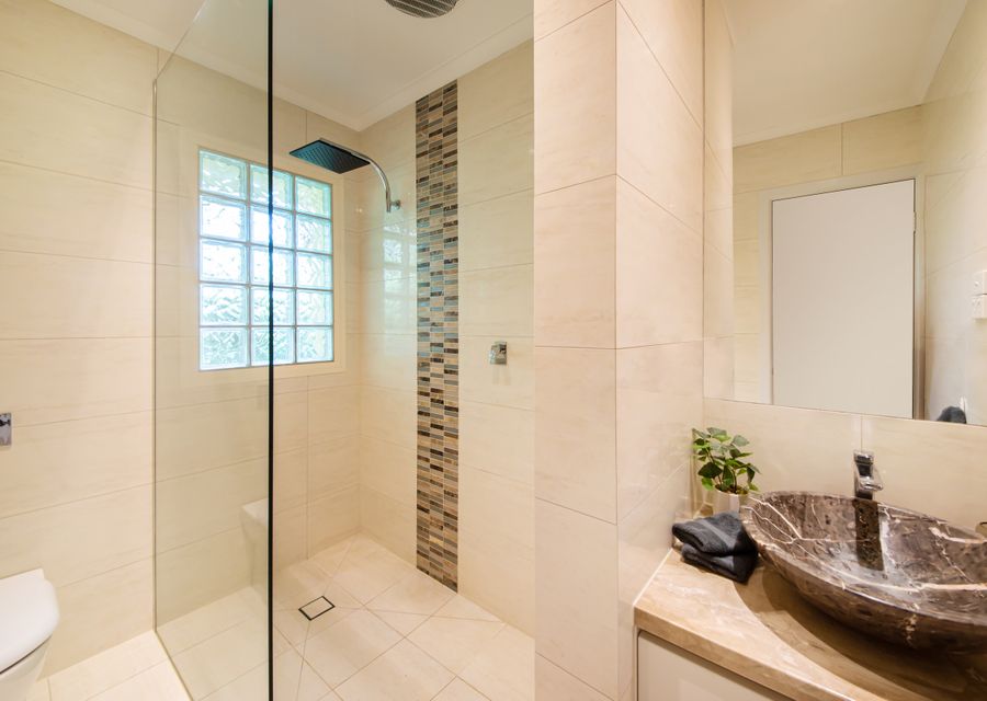 Family bathroom with walk in shower, vanity and toilet