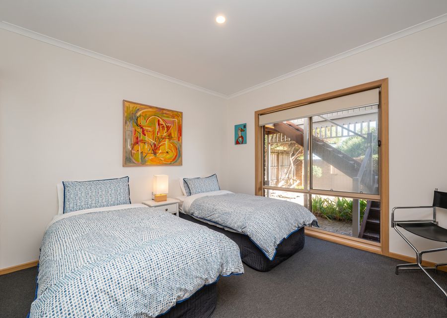 Bedroom four downstairs with two single beds 