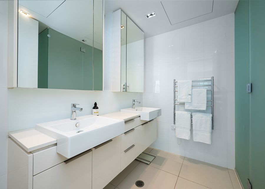Ensuite with double vanity, walk in shower and toilet