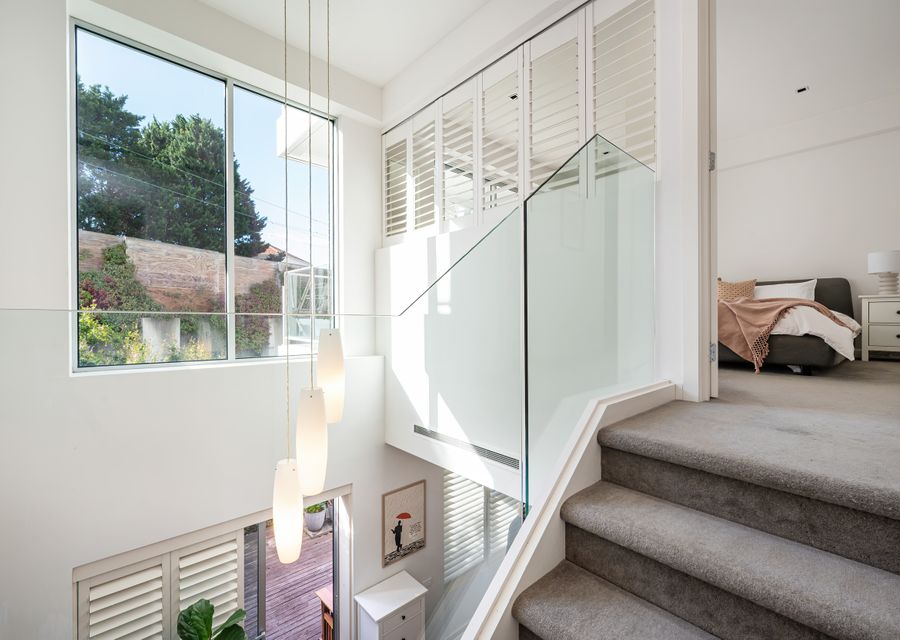 Stairs leading up to the master bedroom with balcony and ensuite