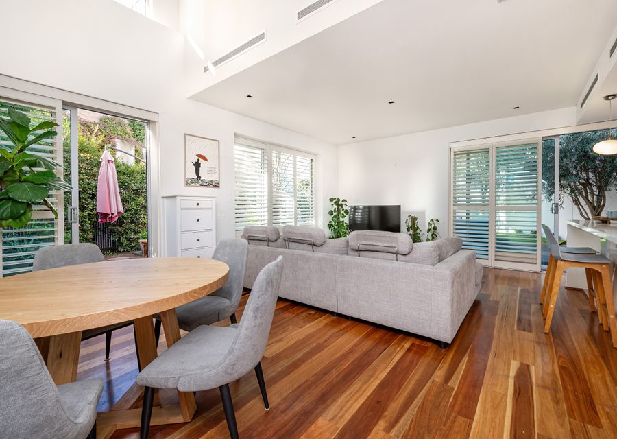 open plan living with sliding doors out to the spacious courtyard