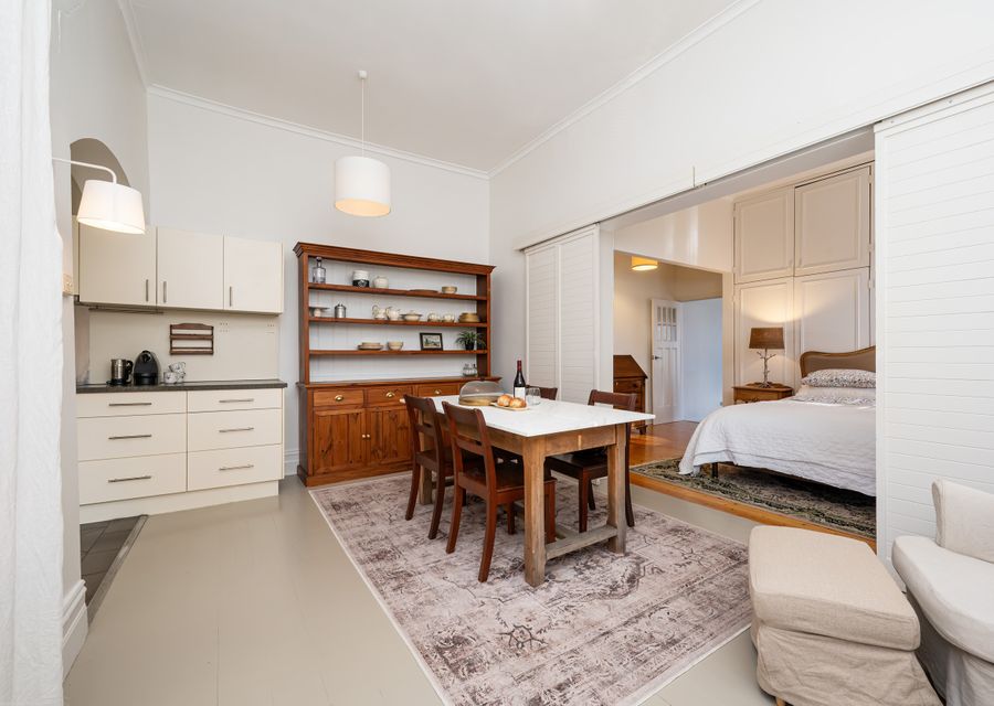 Bedroom leads off from the kitchen dining space through closable wall partion