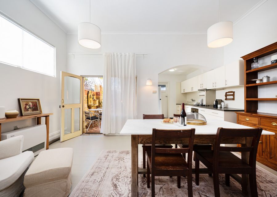 Enter into the cutest kitchen dining area around 