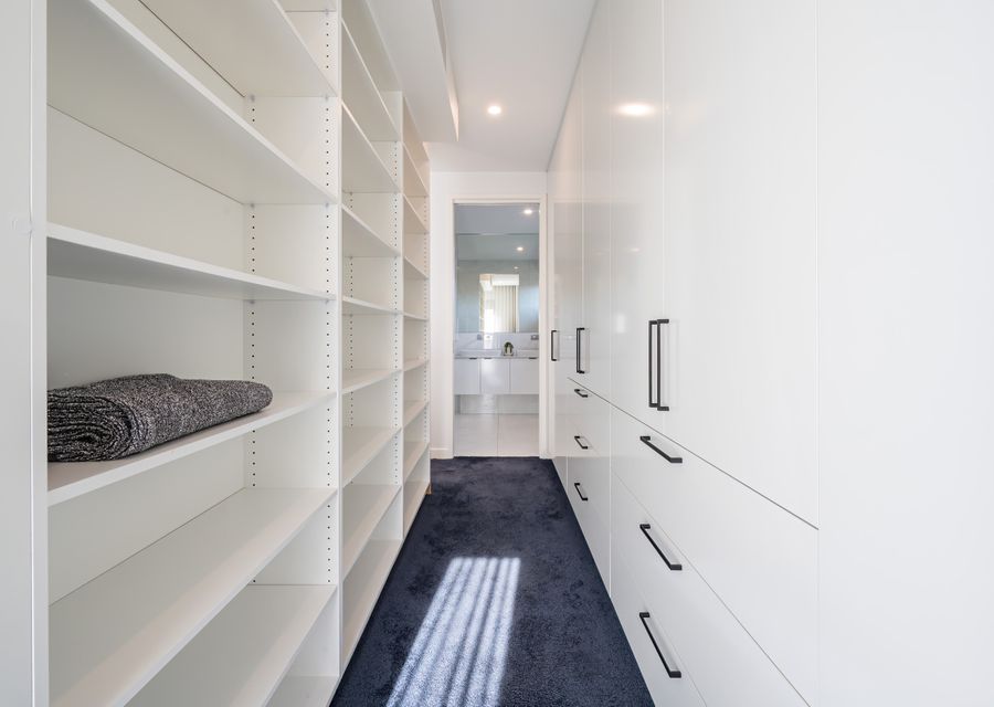 Plenty of storage in master bedroom walk in robe