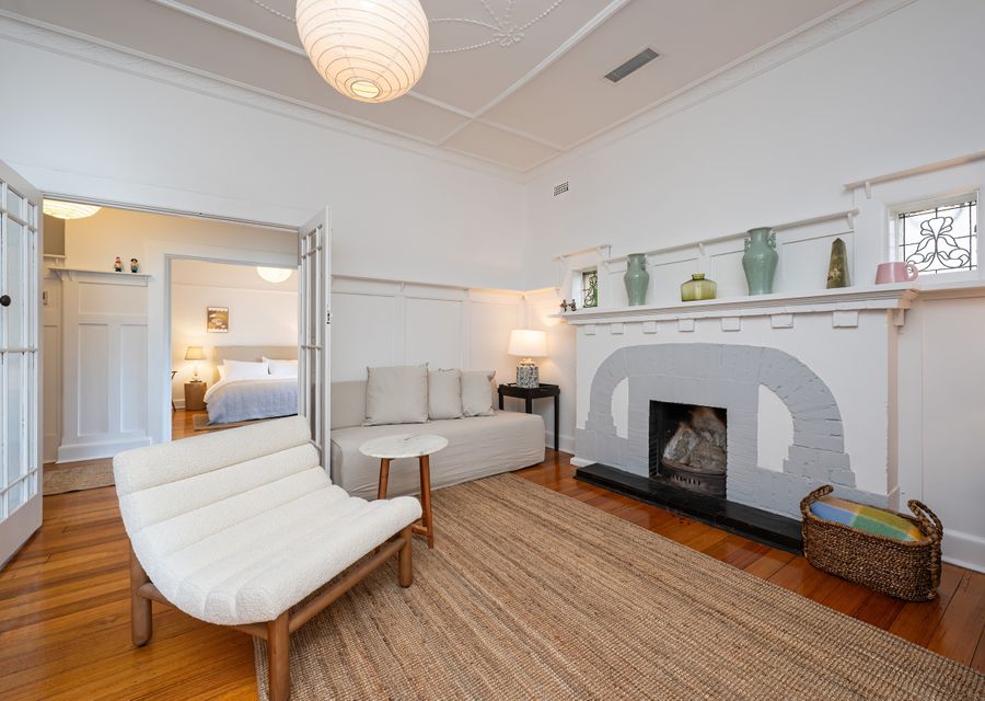 Comfortable living space with double glass doors onto the hallway