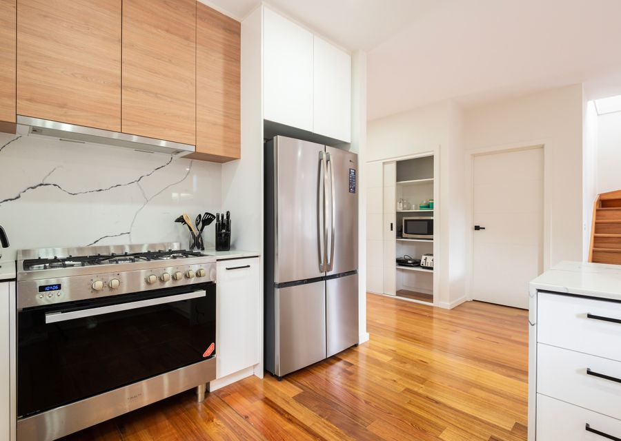 Sleek kitchen with modern, stainless steel appliances