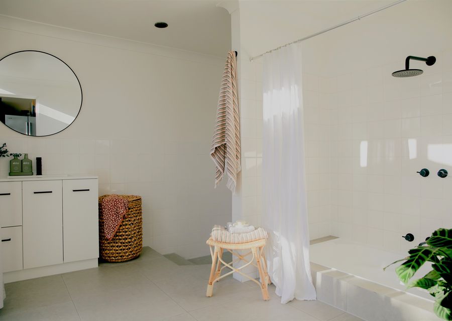 Bathroom with shower over bath.  You need to step down into the bath 