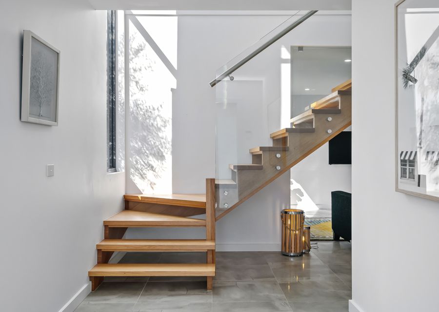 Beautifully designed staircase up to main living and kitchen. 