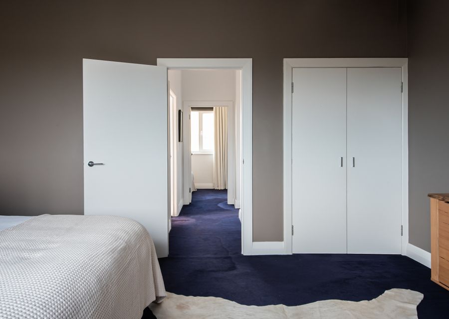 Master bedroom with walk in robe behind the doors
