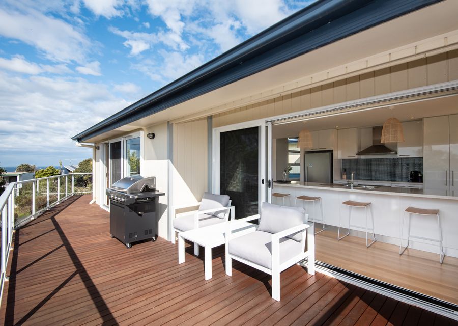 Wrap around merbau decking with BBQ and outdoor comfy seating
