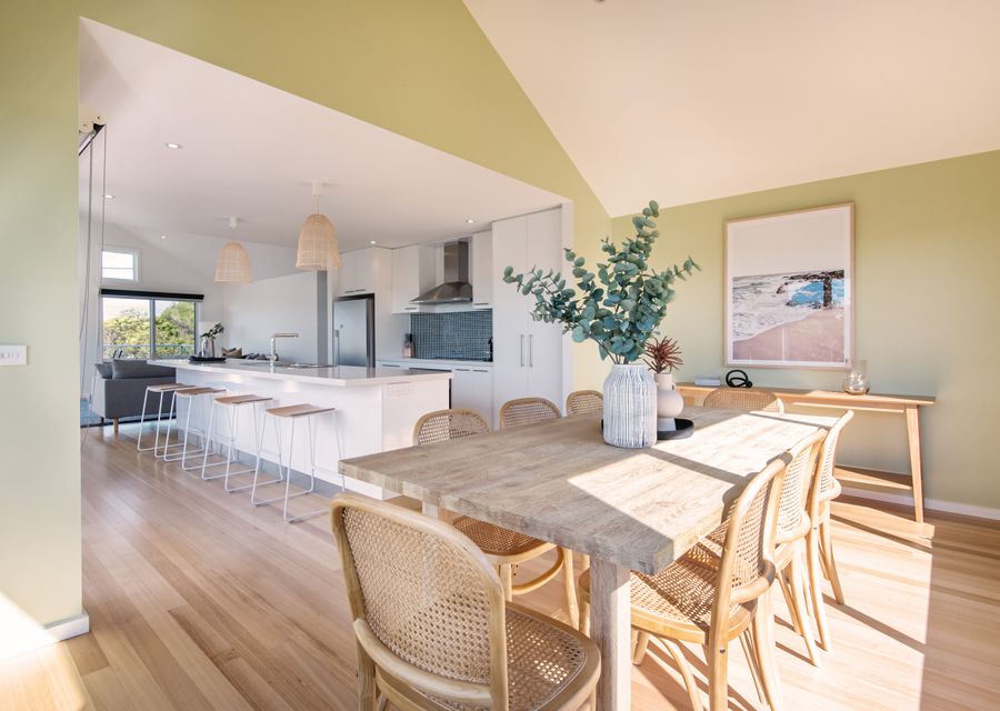 Open plan kitchen  with breakfast bar for 4 people and dining for 8 people
